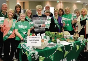  ??  ?? The Macmillan team promoting the gardening group at a previous event