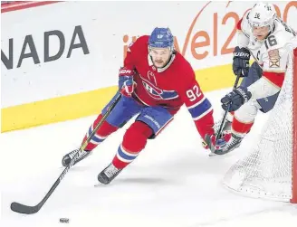  ?? MONTREAL GAZETTE ?? Montreal Canadiens’ Jonathan Drouin holds off Florida Panthers Aleksander Barkov during second period in Montreal on Jan. 15, 2019.