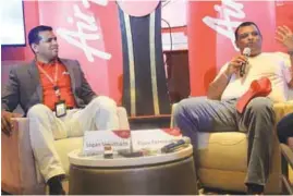  ??  ?? AirAsia Singapore CEO Logan Velaitham (left) and Fernandes explaining AirAsia’s digitalisa­tion plans to the media in Singapore yesterday.
