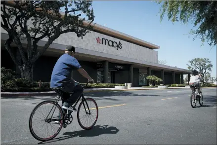  ?? CHRIS CARLSON — THE ASSOCIATED PRESS ?? A closed Macy’s department store in Santa Ana, Calif. Macy’s and other mall-based chains have struggled to adapt during the pandemic.