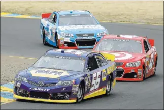  ?? PHOTOS BY ERIC RISBERG/ THE ASSOCIATED PRESS ?? Martin Truex Jr. leads Juan Pablo Montoya and Kasey Kahne through a turn Sunday during the Sprint Cup race at Sonoma, Calif. Truex went on to snap a 218-race winless streak. A late fuel error left Montoya in 34th.