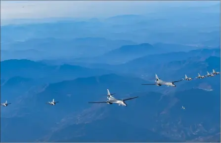  ?? THE ASSOCIATED PRESS ?? In this photo provided by South Korea’s Defense Ministry, two U.S. Air Force B-1B bombers, center, and a flight that includes four South Korean air force F-35 fighter jets and four U.S. Air Force F-16 fighter jets fly over the South Korea Peninsula during a joint air drill called Vigilant Storm,