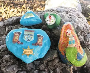  ??  ?? Rocks painted by members of the Alamo Rocks Facebook group are hidden around Alamogordo for other community members to hunt and hide again. These rocks sat outside the Alamogordo Daily News office in late September for residents to find.