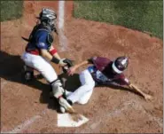  ?? GENE J. PUSKAR - THE ASSOCIATED PRESS ?? Fairfield, Conn.’s Matthew Vivona, right, scores past the attempted tag by Jackson, N.J., catcher J.R. Osmond during the first inning of a baseball game in U.S. pool play at the Little League World Series in South Williamspo­rt, Pa., Thursday, Aug. 17,...