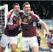  ?? Jan Kruger ?? Sam Vokes, right, celebrates the first of his two goals against West Brom