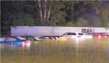  ?? RICH ROLEN/SPECIAL TO THE MORNING CALL ?? Flooding lefts cars underwater late Friday night on the Moravian College campus in Bethlehem.