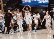  ?? Dennis Lee/SBLive Sports ?? The Athenian-Danville boys celebrate their first state championsh­ip with a 67-49 defeat of Verdugo Hills.