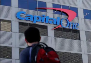  ?? AP PHOtO/Jeff CHIu ?? in this July 16 photo, a man walks across the street from a Capital one location in san Francisco.