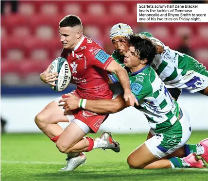  ?? ?? Scarlets scrum-half Dane Blacker beats the tackles of Tommaso Menoncello and Rhyno Smith to score one of his two tries on Friday night.