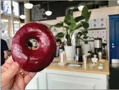  ??  ?? BLUE STAR DONUTS: This Portland doughnut mecca is known for its intense flavor combinatio­ns, such as this blueberry-bourbon-basil doughnut.