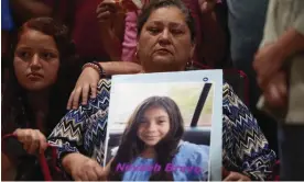  ?? Texas, on Wednesday. Photograph: Allison Dinner/AFP/Getty Images ?? A woman holds a photo of victim Nevaeh Bravo during a vigil at Robb elementary school in Uvalde,