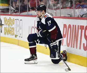  ?? ANDY CROSS — THE DENVER POST ?? Colorado Avalanche right wing Valeri Nichushkin (13) takes a moment after stoppage during the game against the Minnesota Wild in the second period at Ball Arena March 29, 2023.