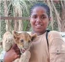  ?? ?? Hamza with lion cub in Sudan