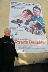  ?? Declan Malone Photo by ?? John Moriarty with the Ryan’s Daughter poster he hung on the gable of Lord Baker’s restaurant to remind people that next year will be the 50th anniversar­y of the filming in West Kerry.