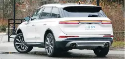  ??  ?? Rear view of the new 2020 Lincoln Corsair Reserve accents its floating fast-sloped roofline and full-width horizontal LED taillight assembly.