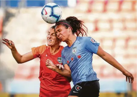  ?? Brett Coomer / Staff photograph­er ?? The Dash’s Haley Hanson, left, and the Red Stars’ Maria Sanchez engage in a painful battle for a header during the second half.