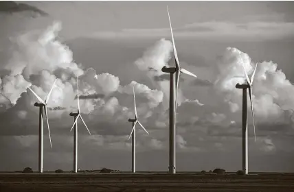  ?? Chris Ratcliffe / Bloomberg ?? Onshore wind turbines dot the Little Cheyne CourtWind Farm near Camber, England. Britain is going to completely phase out coal by 2025 as a growing share of its power comes fromwind farms.