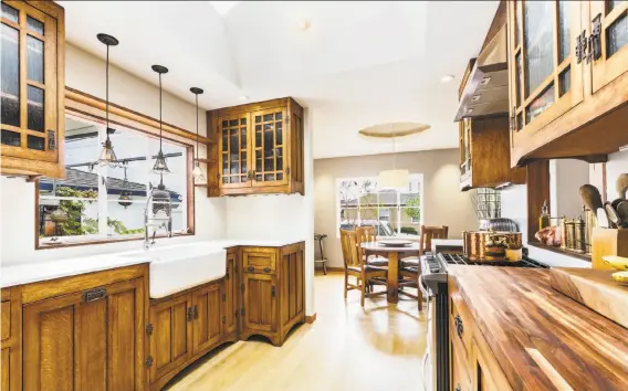  ?? Photograph­y by Rob J. Photos ?? Above: Rob Jordan shot this kitchen in Richmond for a man who completed the woodwork and metalwork himself. The seller was overcome with emotion when he saw the images. Below left: This home in Tiburon features a domed ceiling and views of the water....