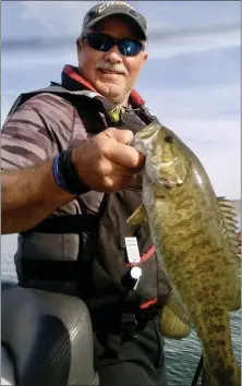  ?? PHOTO CONTRIBUTE­D ?? Picture is good buddy Lyle Valador holding a smallmouth bass he caught while fishing the #5 rated Bass Fishery in the United States, Clear Lake. What makes this so neat is that there are only a handful of “smallies” that live in Clear Lake. By-the-way Lyle hooked it with a HOOTYHOOT jig. NICE JOB Brother Lyle!