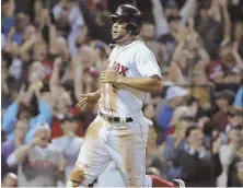  ?? AP PHOTO ?? GETTING A LITTLE HELP: Xander Bogaerts dashes home on a dropped pop-up in the eighth inning last night, giving the Red Sox a 4-3 victory against the Blue Jays.