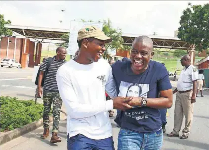  ?? Photo: Thuli Dlamini ?? Protest and pass: #FeesMustFa­ll activist Bonginkosi Khanyile (right) was happy to see his friend Gazuzu Ndoli after being released on bail. Khanyile will graduate cum laude in May.