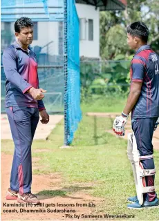  ??  ?? Kamindu (R) stilll gets lessons from his coach, Dhammika Sudarshana
- Pix by Sameera Weerasekar­a