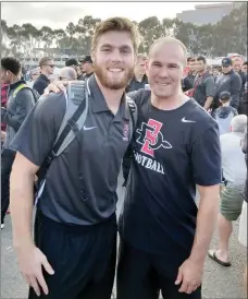  ?? Photo submitted by Stephanie Truitt ?? Former Siloam Springs football standout and current San Diego State senior Parker Baldwin, left, poses with former Panthers assistant coach Tad Davis prior to the Aztecs’ game against Stanford during the 2017 season. Baldwin and Davis developed a close bond while at Siloam Springs.