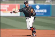  ?? RANDY VAZQUEZ — BANG, FILE ?? The Giants’ Mauricio Dubon throws a ball to first base for an out during the first inning of his team’s Cactus League game against the Diamondbac­ks at Scottsdale Stadium in Scottsdale, Ariz., on Feb. 24.