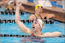  ??  ?? Upper Arlington’s Dakota Elliott celebrates her second straight state title in the 200-yard individual medley Saturday.