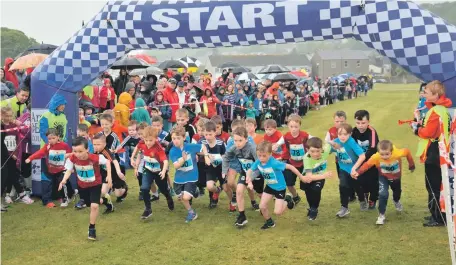  ?? ?? Right: For the first time, junior runners will have timing chips but the focus of their races will still be on having fun. These athletes took part in the seven to eight-year-old boys’ race in 2019