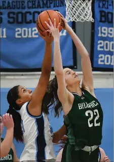  ?? CHRIS CHRISTO — BOSTON HERALD ?? Medfield’s Jailen Annigeri, left, and Billerica’s Kendra Marino compete for a rebound in Medfield’s 50-31 state tournament victory Tuesday night.