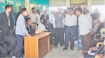  ??  ?? File photo shows Win Myat Aye speaks with Rohingya refugees as he visits Kutupalong camps in Cox’s Bazar. — Reuters photo