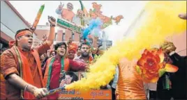  ??  ?? BJP workers celebrate the party’s lead during counting of votes for the Karnataka assembly elections, at the party headquarte­rs in New Delhi, on Tuesday. BURHAAN KINU/HT