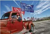  ?? Elizabeth Conley / Staff photograph­er ?? Mike Howell shows his support for President Donald Trump on the back of his 1942 Ford F-1 truck Sunday after participat­ing in a rally on Loop 610.