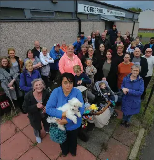  ??  ?? Karen with locals outside Corkerhill Neighbourh­ood HallPictur­es: Colin Mearns