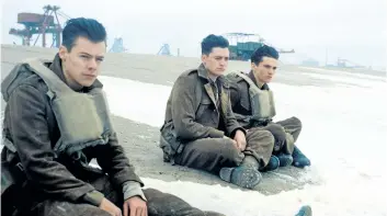  ?? SUPPLIED PHOTO/WARNER BROS PICTURES ?? This image released by Warner Bros. Pictures shows Harry Styles, from left, Aneurin Barnard and Fionn Whitehead in a scene from Dunkirk. Styles, 23, who gained fame with One Direction and recently launched his solo career, plays a British soldier in...