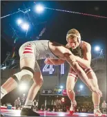  ??  ?? Stanford’s Nathan Traxler, right, and Fresno State’s Danny Salas wrestle during the Battle on the Midway in 2018.