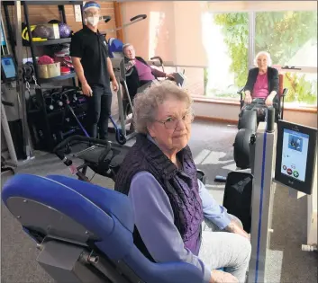  ?? Picture: PAUL CARRACHER ?? Eventide Homes residents are getting fit thanks to a new gymnasium. Physiother­apist Simon Kerrigan puts residents Margaret Jess, front, June Mcclure, left, and Norma Supple through a workout.