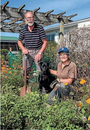  ?? GERHARD UYS/STUFF ?? Despite the hurdles of owning a lifestyle block, there are still many benefits, such as relaxing in the garden – something Pat and Sue Tetley enjoy on their property at Waiau Pa, Auckland.