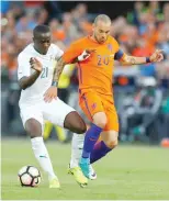  ?? — Reuters ?? Ivory Coast-s Eric Bailly and Netherland­s’ Wesley Sneijder in action.