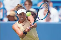  ??  ?? Madison Keys hits a return to Svetlana Kuznetsova in the final of the Western & Southern Open on Sunday in Mason, Ohio.