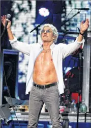  ??  ?? One comedian joked he would donate $1,000 to the Sandy Relief fund if Roger Daltrey of The Who would button his shirt at the 12-12-12 The Concert for Sandy Relief in New York.