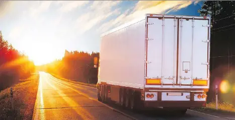  ?? GETTY IMAGES ?? Commercial trucks have large blind spots, especially on the right side, so pass cautiously and give the driver time to react.