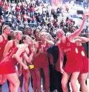  ??  ?? England’s netball stars celebrate their third place with a selfie