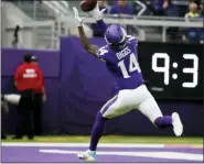  ?? BRUCE KLUCKHOHN — THE ASSOCIATED PRESS ?? Minnesota Vikings wide receiver Stefon Diggs catches a 51-yard touchdown pass during the first half of an NFL football game against the Philadelph­ia Eagles, Sunday in Minneapoli­s.