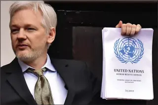  ??  ?? Gloating: Julian Assange ranted for 12 minutes on embassy balcony yesterday