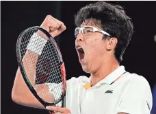  ?? VINCENT THIAN/AP ?? South Korea’s Hyeon Chung reacts after winning a point against Serbia’s Novak Djokovic during their fourth round match in the Australian Open on Monday.