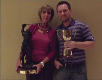  ??  ?? Keeping the trophies in the family - Winners Pauline Lennon and her nephew Adrian Mc Goldrick , with their trophy’s at a recent prize giving in Castle Dargan Golf Club.