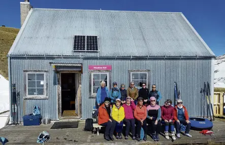  ?? PHOTO: ASPEN BRUCE ?? Camaraderi­e . . . Relaxing outside Meadow Hut after crosscount­ry skiing 3.5km from the base building at Snow Farm are (front, from left) Sarah Prenter, Mary Lee, Hil Kiesow, Suzanne Haydon, Bronwen Cleugh, Sierra Alef, Judith Pringle; (back, from left) Judith Reid, Mary Bruce, Lyne McFarlane, Anita Hallberg, Jackie Cheyne and Karen O’Donahoo.