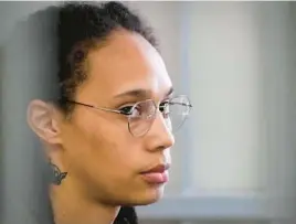  ?? ALEXANDER ZEMLIANICH­ENKO/AFP ?? WNBA superstar Brittney Griner sits inside a defendants’ cage before a hearing on Wednesday at the Khimki Court, outside Moscow.